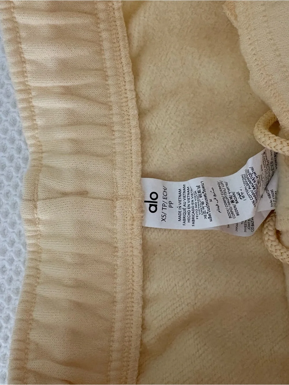 ALO Yoga Cropped Crewneck Sweatshirt in Pale Yellow with matching short